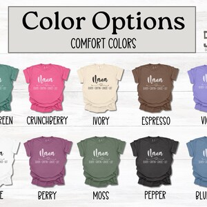 May include: A chart showing 10 different t-shirt colors with the text "Nana" and "Hugs, Cuddles, Grace & Grit" printed on each shirt. The colors are: Light Green, Crunchberry, Ivory, Espresso, Violet, White, Berry, Moss, Pepper, and Blue Jean.