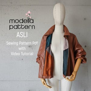 May include: A brown leather jacket with a contrasting patterned interior is displayed on a mannequin. The jacket is open, revealing the colorful lining. Text on the image reads "modella pattern ASLI Sewing Pattern Pdf with Video Tutorial."