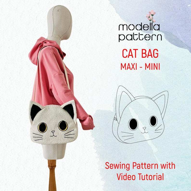 Op de afbeelding: Een naaipatroon voor een kattenvormige tas, verkrijgbaar in maxi- en mini-formaten. Het patroon bevat een video-tutorial. De afbeelding toont een witte kattenvormige tas met zwarte oren en ogen, en een lijntekening van de tas.