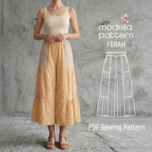 May include: A person wearing a beige tank top and yellow gingham pants. The pants have vertical striped panels and a ruffled hem. The image includes the text "modella pattern FERAH" and "PDF Sewing Pattern".