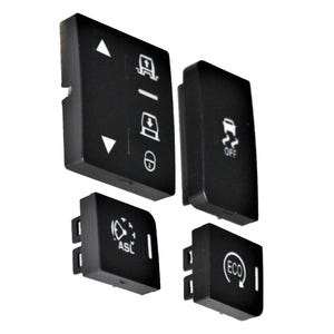 May include: Four black rectangular automotive control buttons with white icons and text. The buttons feature symbols for suspension adjustment, traction control off, ASL speed limiter, and an ECO mode indicator, each with distinct white markings.