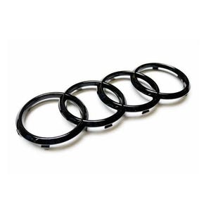 May include: Four interlocking black rings, forming the iconic Audi logo.