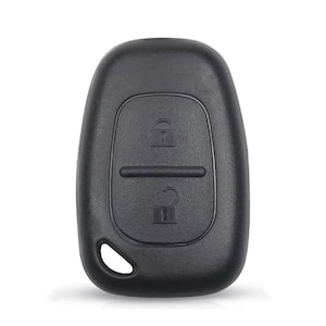 May include: A black plastic car key fob with a rounded rectangular shape. The device features two buttons, one with a locked padlock icon and one with an unlocked padlock icon, and includes a small circular hole at the bottom for a keychain attachment.