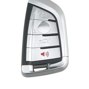 May include: A silver car key with four buttons. The buttons have icons for unlock, trunk, car, and a speaker with sound waves.