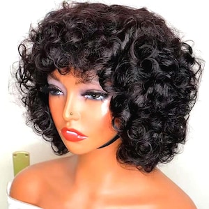 May include: A short, curly, black wig with a side part. The wig is styled in a bob shape and has a natural, voluminous look.