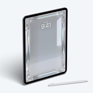 May include: A black tablet with a diamond-like border, displaying the time 9:41 on the screen. A white stylus pen rests below the tablet on a white surface. The tablet has a sleek, modern design.