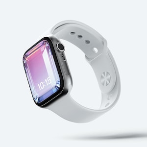 Puede incluir: Un reloj inteligente plateado con una correa blanca. La pantalla del reloj muestra la hora 10:15. El reloj se muestra sobre un fondo blanco.