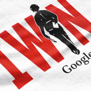 May include: White t-shirt with a red graphic of the word "TWIN" and a black silhouette of a person. The words "Google Me" are printed in black.