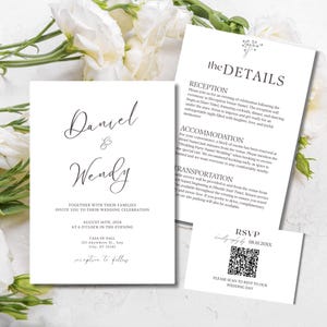 May include: Elegant wedding invitation suite featuring the names "Daniel & Wendy" in script font. Includes details card, RSVP card with QR code, and invitation with event information. White with floral accents.