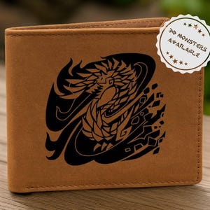 May include: A brown leather wallet featuring a black dragon design. The wallet has a bi-fold design and a stitched border. A circular sticker in the upper right corner reads "30 MONSTERS AVAILABLE".