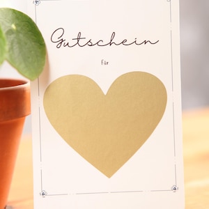 Buono, buono con cuore da grattare, buono da grattare, carta come buono, carta da grattare, carta con cuore dorato, gratta e vinci