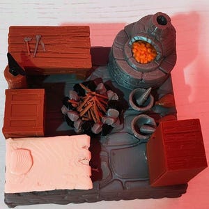 May include: A detailed miniature blacksmith's workshop diorama. It includes a forge with glowing orange embers, a small campfire, wooden crates, and tools. The scene is crafted with various colours and textures, creating a detailed miniature environment.