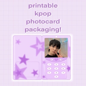 May include: Printable Kpop photocard packaging template. A purple phone-shaped design with a star pattern and a photo slot. The phone has a keypad with numbers 1-9 and 0.