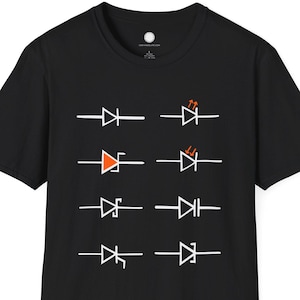 May include: Black t-shirt featuring a series of white and orange electronic circuit symbols. The symbols include diodes and LED indicators. The shirt is a short-sleeved crew neck.