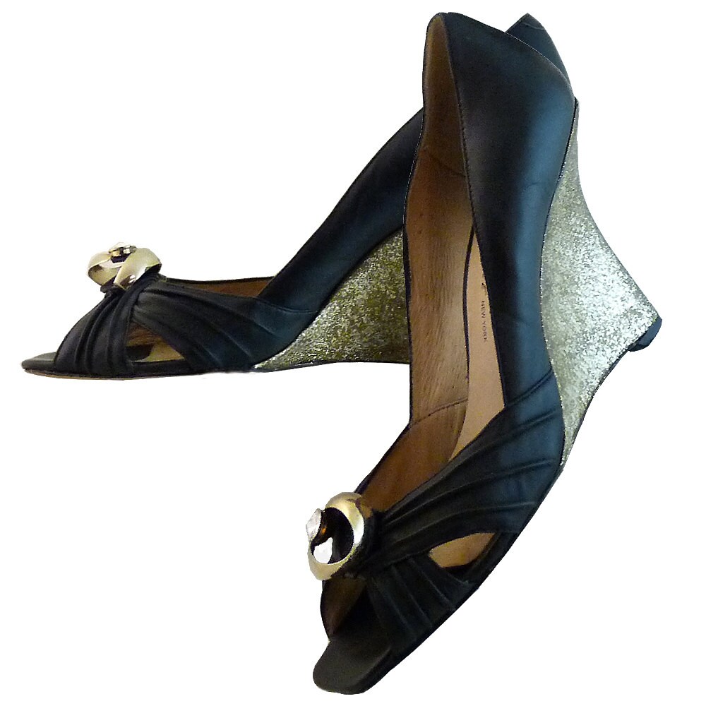 black and gold wedge trainers