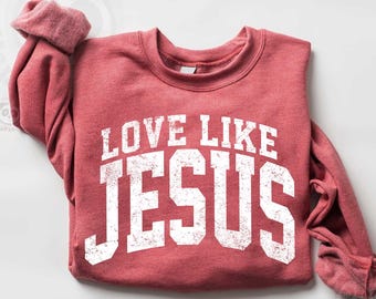 May include: Red sweatshirt with a white distressed graphic that says "Love Like Jesus".