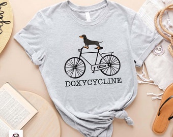 funny Pharmacist Shirt, Doxycycline Pharmacy Pun TShirt, Dachshund on Bicycle, Veterinary Tee, Pharmacy Gift, Pharmacists & Technicians Gift