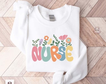 Gebloemd verpleegkundige sweater, nieuw verpleegkundige cadeau, groovy verpleegkundige waardering, trui verpleegkundige student, gediplomeerd verpleegkundige shirt sweatshirt verpleegschool