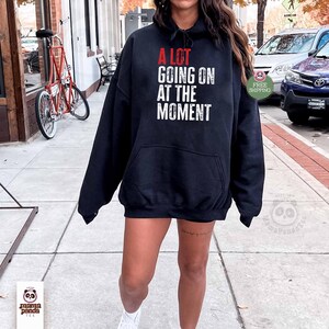 black color swift concert sweatshirt "A Lot Going on at the moment" sweatshirt music concert sweatshirt and hoodie eras tour concert sweater