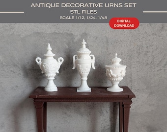 May include: Three white antique decorative urns with intricate designs are displayed on a dark brown table. The urns vary in shape and size, each with a unique lid and ornate detailing. The image includes the text "ANTIQUE DECORATIVE URNS SET STL FILES DIGITAL DOWNLOAD".