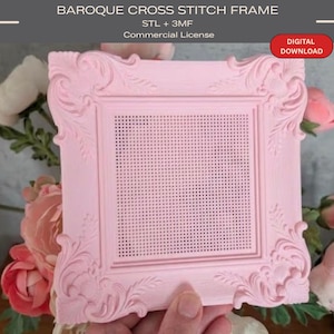 May include: A light pink square cross stitch frame featuring ornate scrollwork details on the corners and edges. The center contains a grid of small holes for stitching. Text on the image reads: BAROQUE CROSS STITCH FRAME, STL + 3MF, Commercial License, DIGITAL DOWNLOAD.