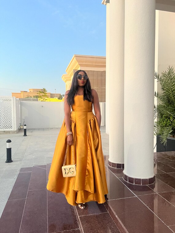 slim fit dress slacks Gold Embellished Beaded Column Cape Gown main image 0