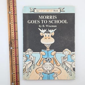 May include: A vintage children's book titled "Morris Goes to School" by B. Wiseman. The cover features a cartoon illustration of a moose wearing a school uniform and holding a book.