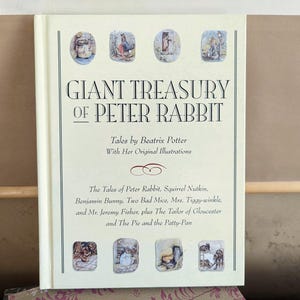 May include: A book titled "Giant Treasury of Peter Rabbit" by Beatrix Potter with her original illustrations. The book features a collection of classic tales including "The Tales of Peter Rabbit", "Squirrel Nutkin", "Benjamin Bunny", "Two Bad Mice", "Mrs. Tiggy-winkle", "Mr. Jeremy Fisher", "The Tailor of Gloucester", and "The Pie and the Patty-Pan".