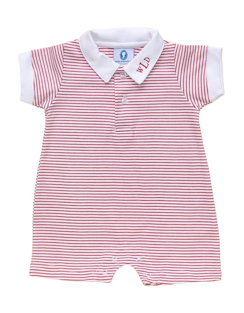 May include: A red and white striped baby onesie with a white collar and the letters "WLD" embroidered on the collar.