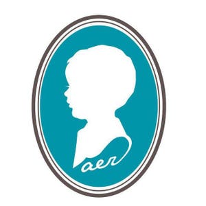 May include: A teal blue oval frame with a white silhouette of a child's head in profile. The word "aer" is written in white script inside the frame.