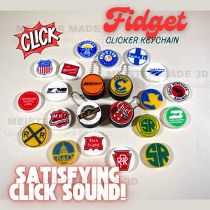 May include: A collection of colorful, round, 3D printed keychains featuring various railroad logos. The keychains are arranged in a circle around a single keychain with a red, white, and blue logo that reads "Chief". The keychains are all attached to a silver chain. The text "Fidget Clicker Keychain" is written in red and white letters at the top of the image. The text "SATISFYING CLICK SOUND!" is written in red and white letters at the bottom of the image.