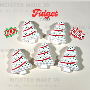 May include: White Christmas tree-shaped fidget clickers with red and green accents. The image includes the text "Fidget Clicker" in red, and "CLICK" in a comic book style. The product is 3D printed.