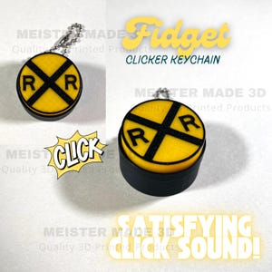May include: A yellow and black railroad crossing sign keychain with a clicker mechanism. The keychain is made of 3D printed plastic and has a satisfying click sound.