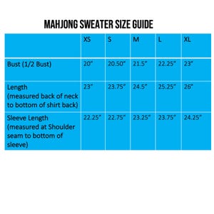 May include: A size guide for a Mahjong sweater, with measurements in inches. The guide includes bust, length, and sleeve length measurements for sizes XS to XL. The text is in white on a blue background.