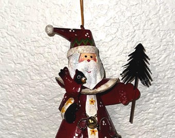 Patience Brewster Mini Dashing Krinkles whimsical Santa with a tree ornament.