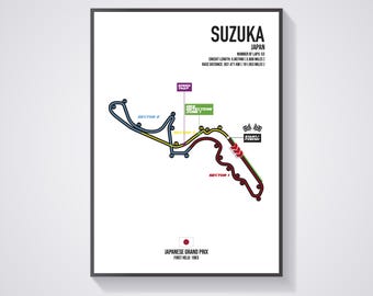 May include: A black and white illustration of the Suzuka Circuit race track in Japan. The track is outlined in blue, with yellow and red markings. The text "SUZUKA" and "JAPAN" is at the top of the illustration. The text "JAPANESE GRAND PRIX" and "FIRST HELD 1963" is at the bottom of the illustration.
