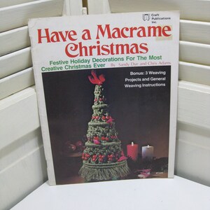May include: A book titled "Have a Macrame Christmas" featuring a green macrame Christmas tree on the cover. The book is by Sandy Dye and Chris Adams and includes instructions for 3 weaving projects.
