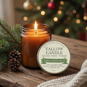 May include: A 9 oz tallow candle in a clear glass jar with a lit wick. The label reads Simply Natural Apothecary Tallow Candle Christmas Tree, 100% Grassfed Beef Tallow, Organic Beeswax, Essential Oil. Two pinecones sit beside the jar.