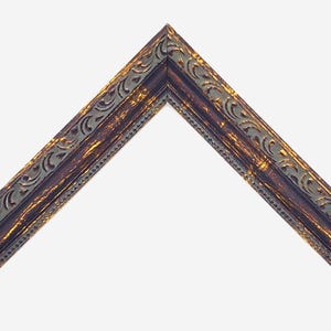 May include: An L-shaped corner section of a picture frame featuring a dark brown finish with distressed gold highlights. The frame displays an intricate embossed scrollwork pattern along the outer edge and a fine beaded texture along the inner edge.