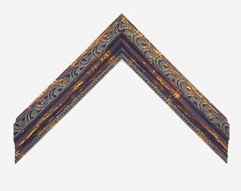 May include: An L-shaped corner section of a picture frame featuring a dark brown finish with distressed gold highlights. The frame displays an intricate embossed scrollwork pattern along the outer edge and a fine beaded texture along the inner edge.