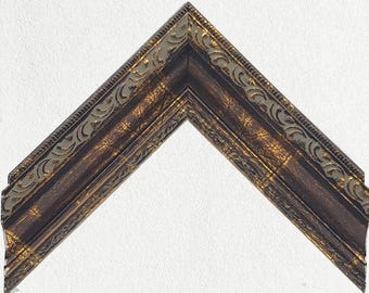 Cornice decorata in bronzo