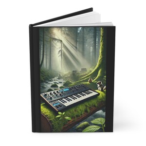 May include: A black and blue synthesizer keyboard sits on a mossy log in a sun-dappled forest. The keyboard has a silver knob and a black and white keyboard. The forest is lush and green with a stream running through it.