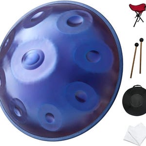 May include: A blue handpan with multiple circular sound holes. Accessories include a red folding stool, two wooden mallets with black heads, a black carrying case, and two white cleaning cloths. The handpan has a metallic sheen.