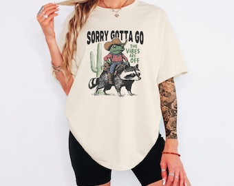 Funny Frog Cowboy Shirt, Sorry Gotta Go The Vibes Are Off Tee, Raccoon Graphic Shirt