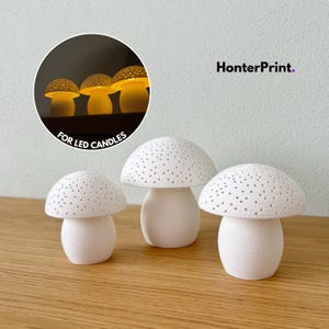 May include: Three white mushroom-shaped candle holders with perforated caps. The text HonterPrint and FOR LED CANDLES appears in the image. The mushroom caps feature small holes that allow light to pass through when illuminated from within.