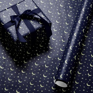 Premium celestial gift wrap with gold moons and stars in rich tones