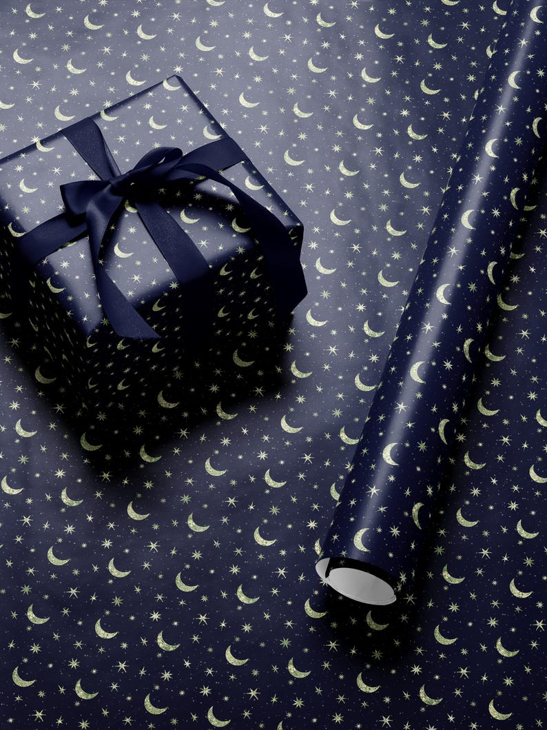Premium celestial gift wrap with gold moons and stars in rich tones