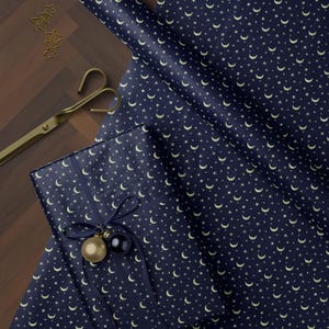 Luxury navy blue moon and star wrapping paper with gold details