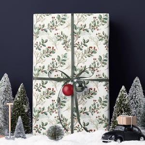 Botanical red berry wrapping paper for winter birthdays or nature-inspired events
Elegant vintage Christmas wrapping paper with green leaves and red berries