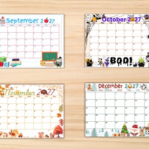 May include: Four monthly calendar pages for September, October, November, and December 2027. September features school supplies and an owl. October has Halloween motifs and the text BOO!. November displays autumn leaves and turkeys. December shows winter scenes with Santa.
